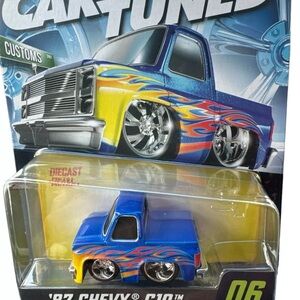 Blue and Yellow Diecast Toy Truck with Oversized Wheels